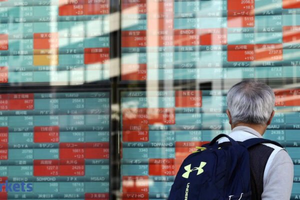 Asian stocks start cautious, dollar holds drop