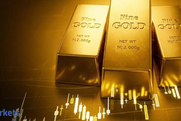 Gold ticks higher, set for weekly gain on softer dollar